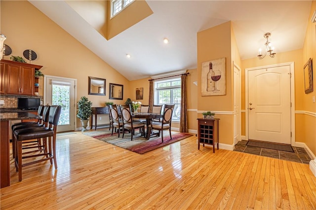500 Mendon Rd Unit 116, Cumberland, RI 02864 - dining room featuring light wood-type flooring, a chandelier, high vaulted ceiling, and recessed lighting