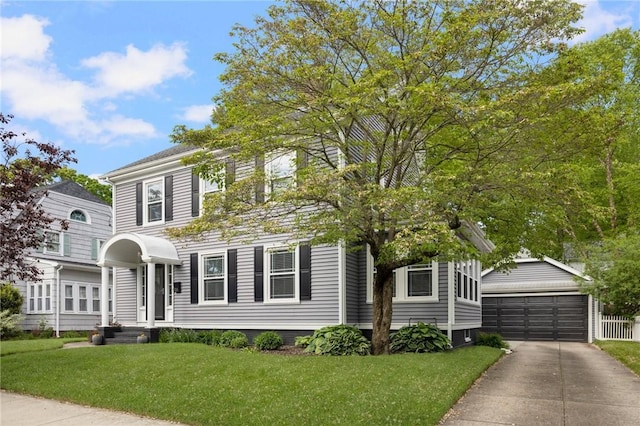 224 Raleigh Ave, Pawtucket, RI 02860 - view of front of house with an outdoor structure, a front yard, and a detached garage