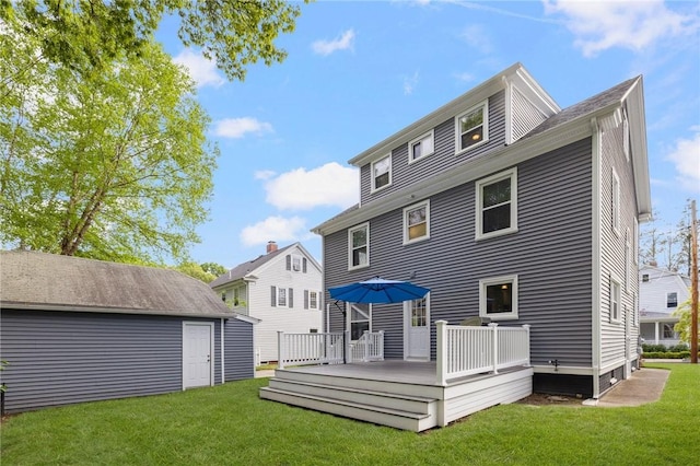 224 Raleigh Ave, Pawtucket, RI 02860 - back of house with a yard, a wooden deck, and an outbuilding
