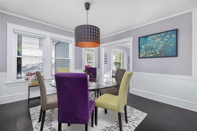 224 Raleigh Ave, Pawtucket, RI 02860 - dining space featuring ornamental molding, wood finished floors, arched walkways, and wainscoting