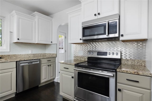 224 Raleigh Ave, Pawtucket, RI 02860 - kitchen with stainless steel appliances, backsplash, dark wood-type flooring, and white cabinets