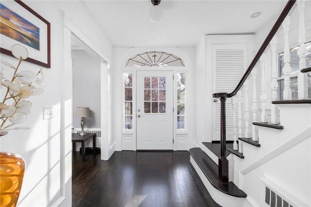 224 Raleigh Ave, Pawtucket, RI 02860 - entrance foyer with stairway, dark wood-style flooring, and baseboards