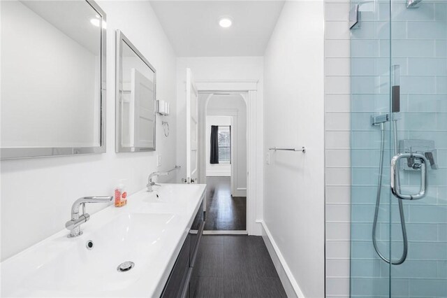 224 Raleigh Ave, Pawtucket, RI 02860 - full bath featuring a stall shower, double vanity, baseboards, recessed lighting, and wood finished floors
