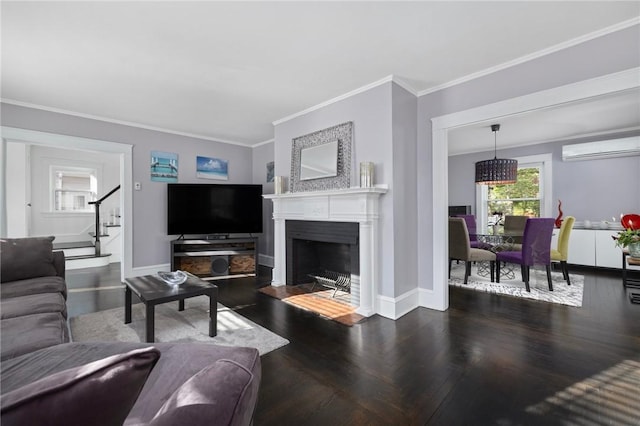 224 Raleigh Ave, Pawtucket, RI 02860 - living area featuring a wall unit AC, stairs, crown molding, a fireplace with flush hearth, and baseboards