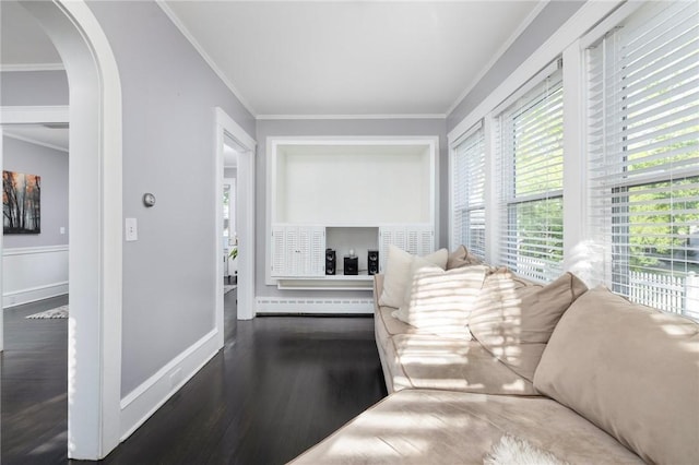 224 Raleigh Ave, Pawtucket, RI 02860 - living room featuring arched walkways, ornamental molding, wood finished floors, and baseboards