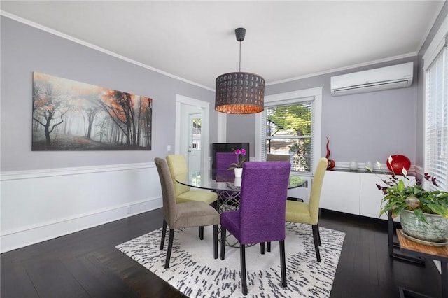 224 Raleigh Ave, Pawtucket, RI 02860 - dining room with a wall unit AC, crown molding, wood finished floors, and baseboards