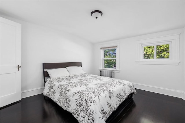 224 Raleigh Ave, Pawtucket, RI 02860 - bedroom with radiator heating unit, baseboards, and dark wood-style flooring