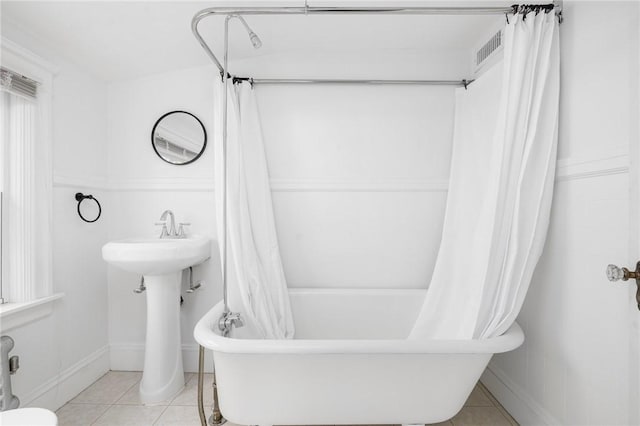 224 Raleigh Ave, Pawtucket, RI 02860 - full bath featuring tile patterned flooring, shower / bath combo with shower curtain, baseboards, and a sink