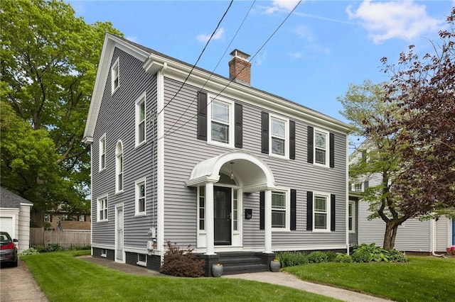 224 Raleigh Ave, Pawtucket, RI 02860 - colonial house featuring a chimney