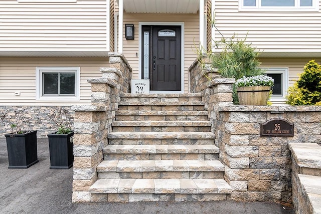26 Ivy Hollow Ct, Cranston, RI 02921 - doorway to property featuring stone siding