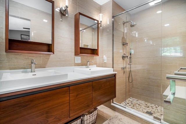 26 Ivy Hollow Ct, Cranston, RI 02921 - bathroom with a shower stall, tile walls, and double vanity