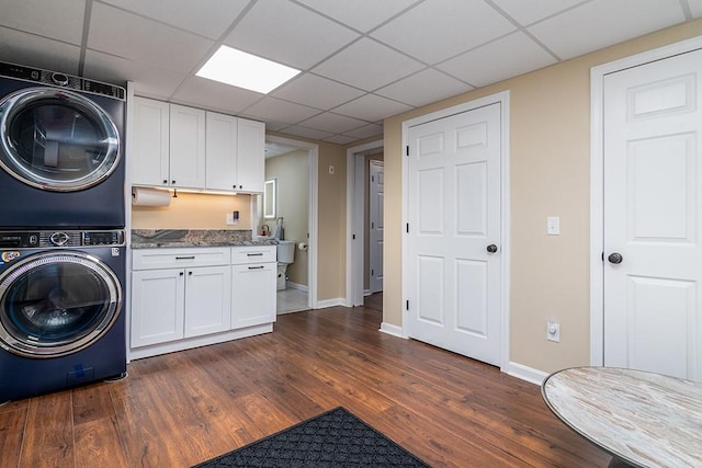 26 Ivy Hollow Ct, Cranston, RI 02921 - washroom with estacked washer and dryer, dark wood finished floors, and baseboards
