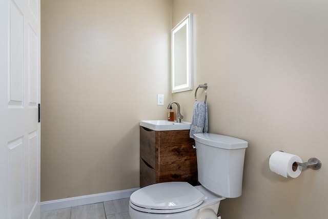 26 Ivy Hollow Ct, Cranston, RI 02921 - bathroom featuring toilet, vanity, and baseboards