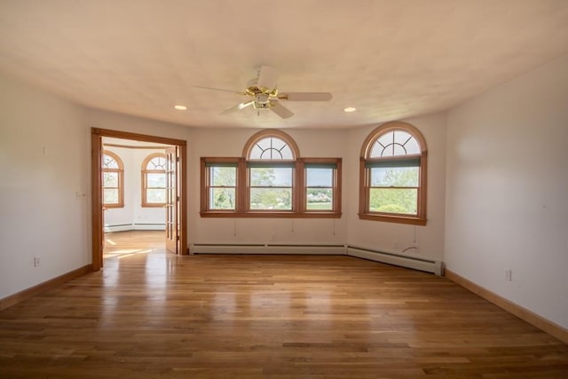 3622 Main Rd, Tiverton, RI 02878 - unfurnished room featuring wood finished floors, ceiling fan, recessed lighting, baseboards, and a baseboard heating unit