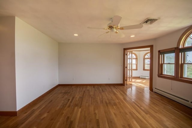 3622 Main Rd, Tiverton, RI 02878 - unfurnished room featuring baseboard heating, baseboards, wood finished floors, and recessed lighting