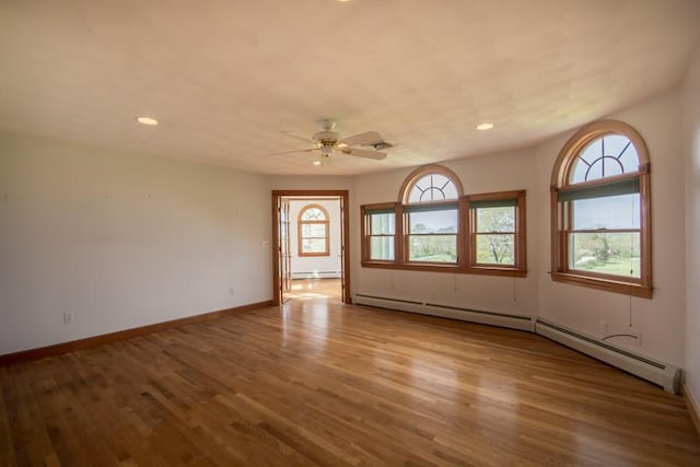 3622 Main Rd, Tiverton, RI 02878 - empty room featuring a baseboard heating unit, wood finished floors, a ceiling fan, recessed lighting, and baseboards