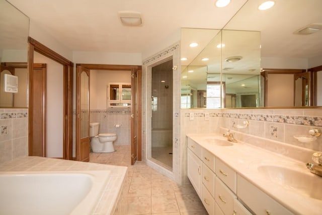 3622 Main Rd, Tiverton, RI 02878 - full bathroom featuring tile walls, tile patterned floors, toilet, double vanity, and a stall shower