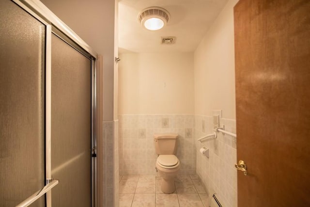 3622 Main Rd, Tiverton, RI 02878 - full bath with tile patterned flooring, a stall shower, a wainscoted wall, toilet, and baseboard heating
