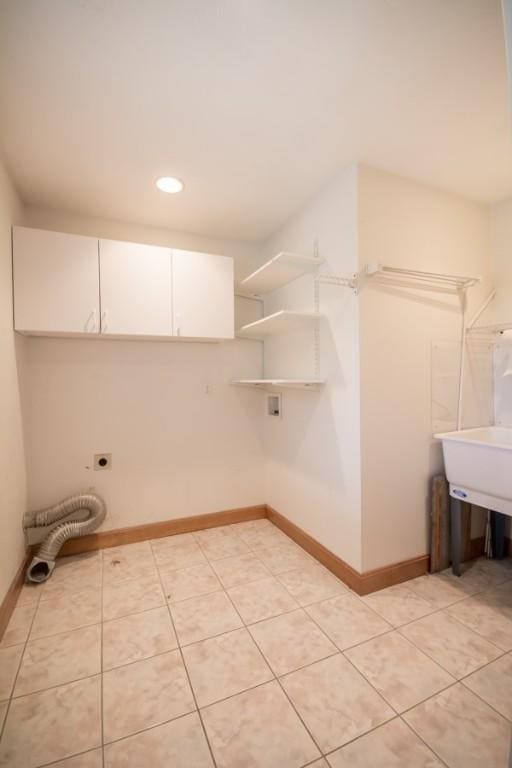 3622 Main Rd, Tiverton, RI 02878 - laundry area featuring hookup for an electric dryer, baseboards, recessed lighting, cabinet space, and light tile patterned flooring