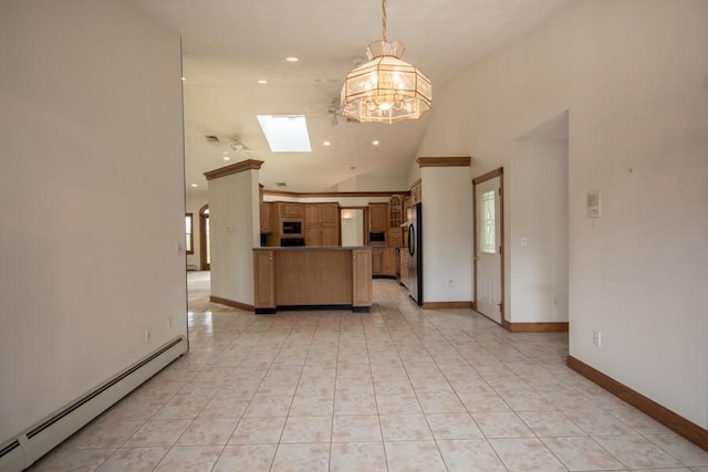 3622 Main Rd, Tiverton, RI 02878 - kitchen featuring a baseboard heating unit, freestanding refrigerator, white microwave, a chandelier, and a peninsula