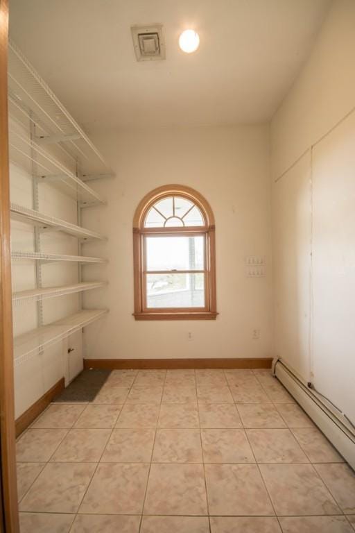 3622 Main Rd, Tiverton, RI 02878 - empty room with a baseboard radiator and baseboards