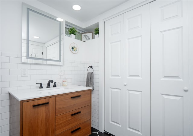 24 Southmayd St, Newport, RI 02840 - bathroom with vanity, a closet, and tile walls