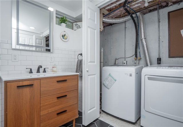 24 Southmayd St, Newport, RI 02840 - washroom featuring separate washer and dryer and light tile patterned floors