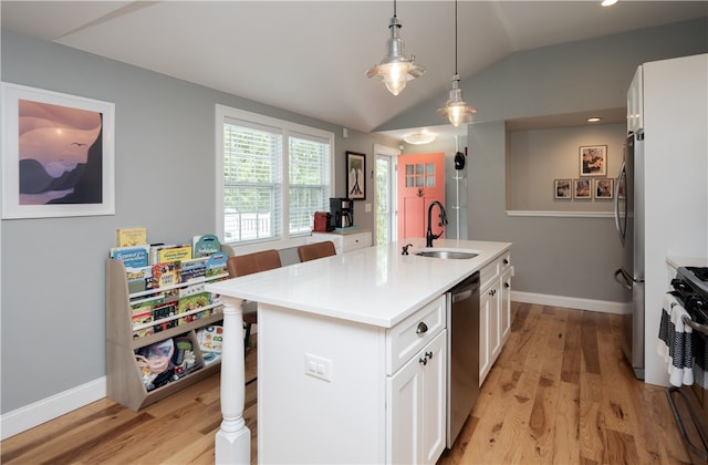 24 Southmayd St, Newport, RI 02840 - kitchen featuring a sink, appliances with stainless steel finishes, a kitchen bar, vaulted ceiling, and light wood-type flooring