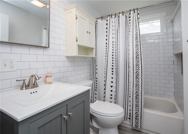 24 Southmayd St, Newport, RI 02840 - full bathroom with toilet, vanity, decorative backsplash, and tile walls