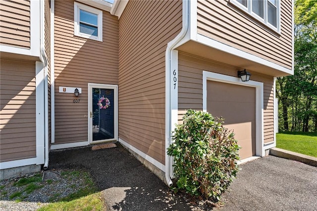 607 Brookhaven Ln, Woonsocket, RI 02895 - entrance to property with an attached garage