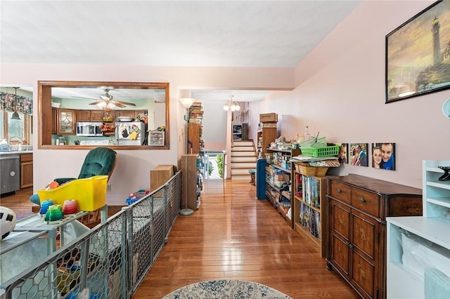 607 Brookhaven Ln, Woonsocket, RI 02895 - hall with wood-type flooring, a chandelier, stairway, and a sink