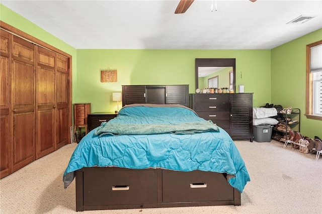 607 Brookhaven Ln, Woonsocket, RI 02895 - bedroom with light carpet, ceiling fan, and a closet