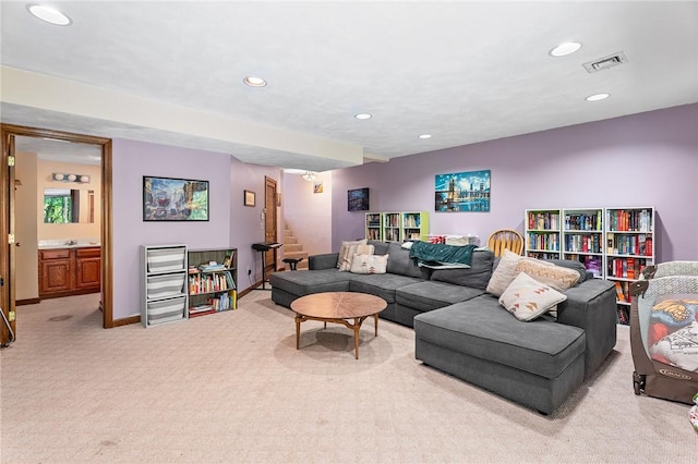 607 Brookhaven Ln, Woonsocket, RI 02895 - living room with light colored carpet, recessed lighting, stairs, and baseboards