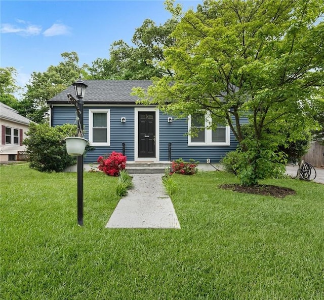 92 Martha St, Pawtucket, RI 02860 - view of front facade with a front lawn and a shingled roof