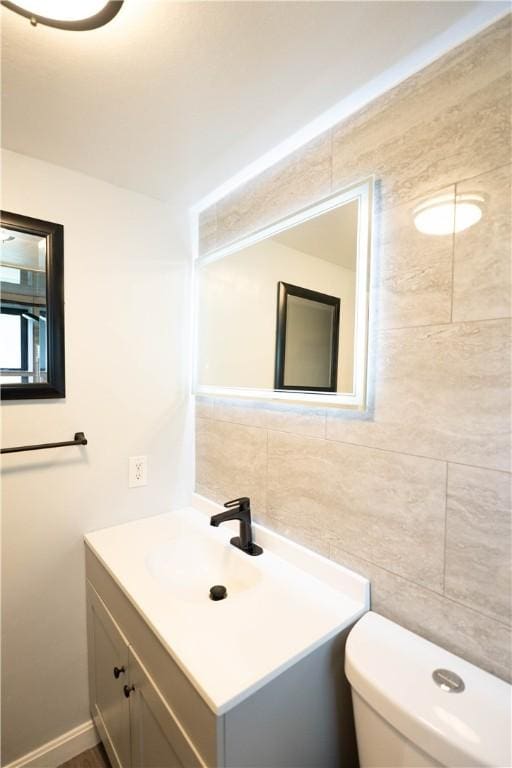 76 Park St Unit C1, Pawtucket, RI 02860 - bathroom with tile walls, toilet, and vanity
