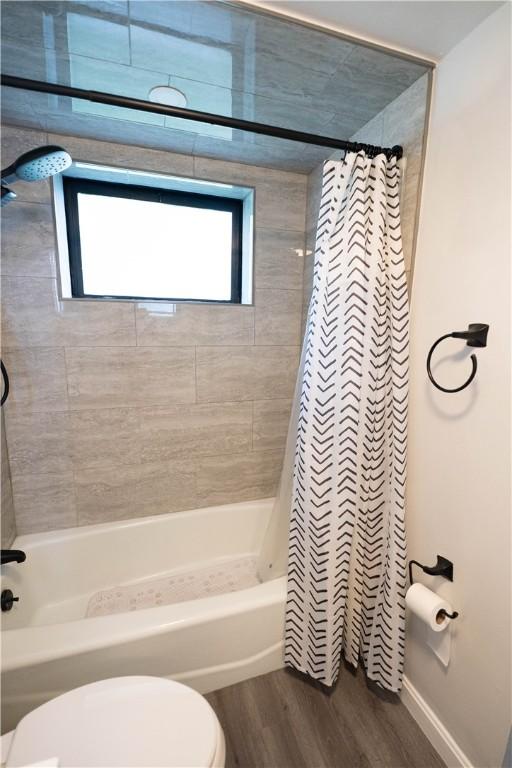 76 Park St Unit C1, Pawtucket, RI 02860 - full bath featuring shower / tub combo, toilet, and wood finished floors