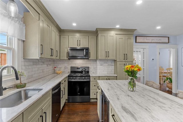 261 Columbus Ave, Pawtucket, RI 02861 - kitchen featuring black range with gas stovetop, a sink, stainless steel dishwasher, wine cooler, and light stone countertops