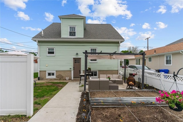 261 Columbus Ave, Pawtucket, RI 02861 - rear view of property with a garden, outdoor lounge area, a shingled roof, a patio, and a pergola