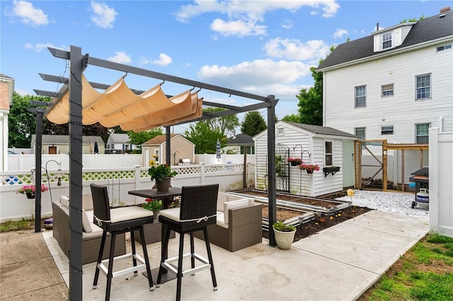 261 Columbus Ave, Pawtucket, RI 02861 - fenced backyard featuring a patio, outdoor dining area, a pergola, and a residential view