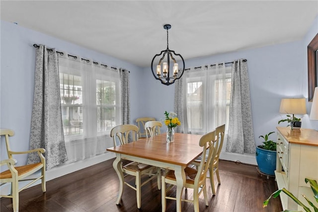 261 Columbus Ave, Pawtucket, RI 02861 - dining area featuring a chandelier, baseboards, and dark wood-style flooring