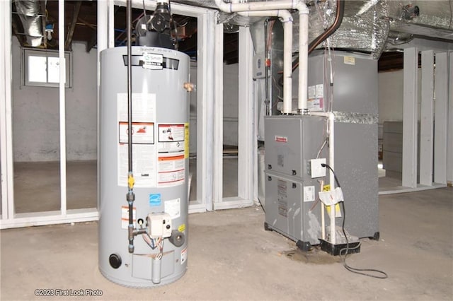 261 Columbus Ave, Pawtucket, RI 02861 - utility room featuring gas water heater and heating unit