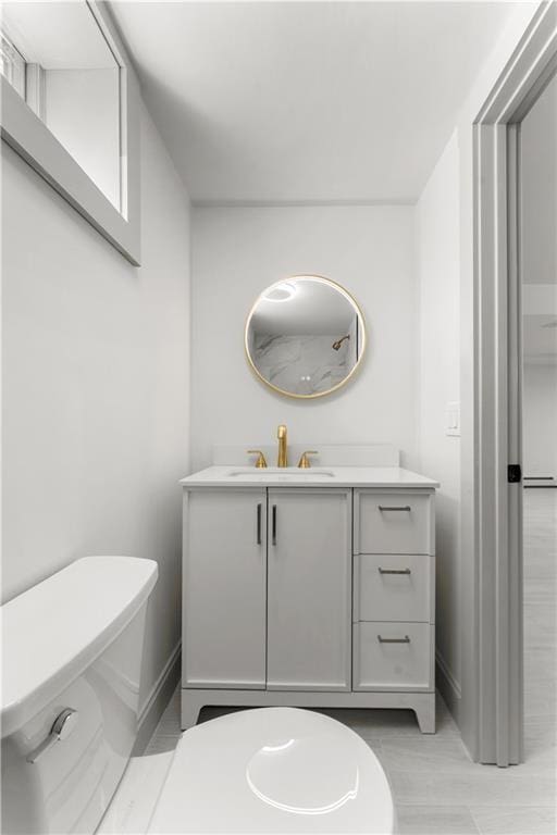 1314 Chalkstone Ave, Providence, RI 02908 - bathroom featuring vanity, toilet, and baseboards