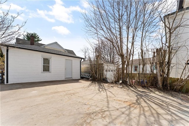 1314 Chalkstone Ave, Providence, RI 02908 - view of property exterior with a chimney and roof with shingles