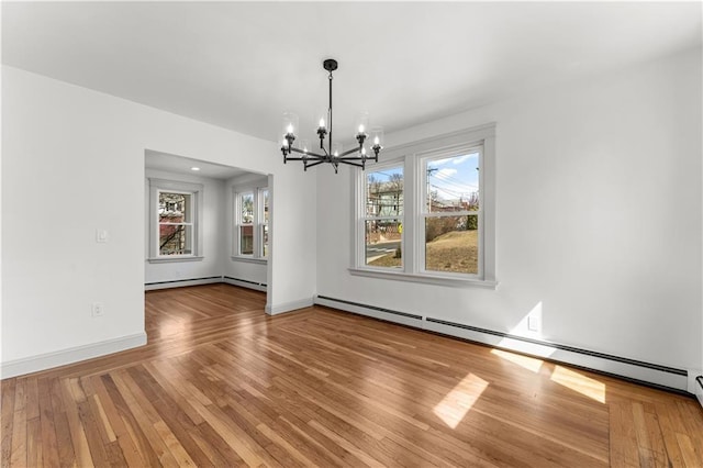 1314 Chalkstone Ave, Providence, RI 02908 - unfurnished dining area with a chandelier, a baseboard heating unit, hardwood / wood-style flooring, and baseboards