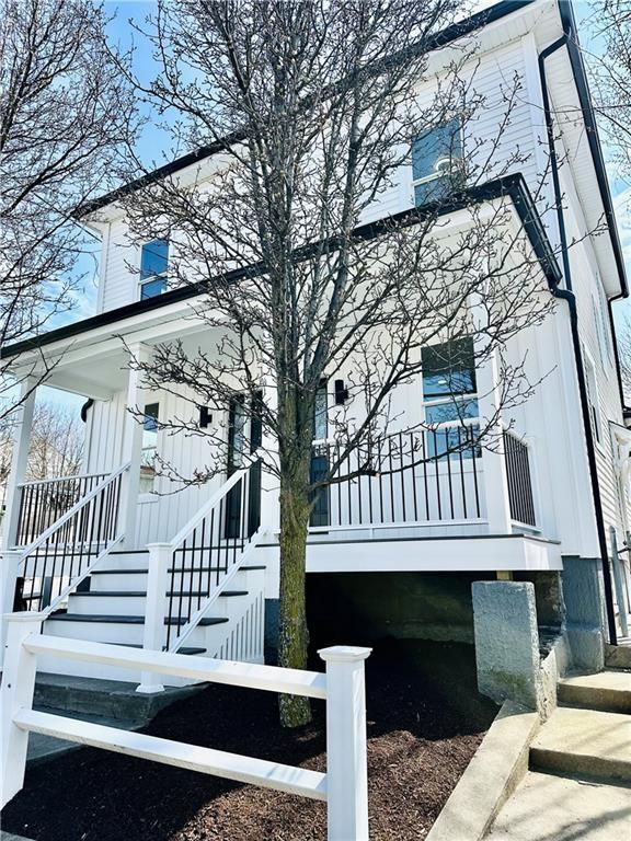 1314 Chalkstone Ave, Providence, RI 02908 - view of side of property featuring stairway and a porch