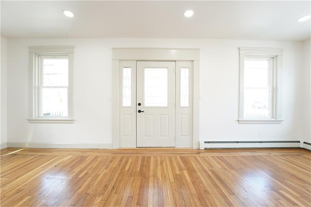 1314 Chalkstone Ave, Providence, RI 02908 - foyer with baseboard heating, light wood finished floors, recessed lighting, and baseboards