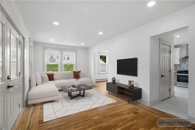 1314 Chalkstone Ave, Providence, RI 02908 - living area with light wood-type flooring, a baseboard radiator, and recessed lighting