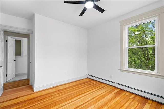 1314 Chalkstone Ave, Providence, RI 02908 - empty room with a baseboard heating unit, plenty of natural light, light wood finished floors, and a ceiling fan