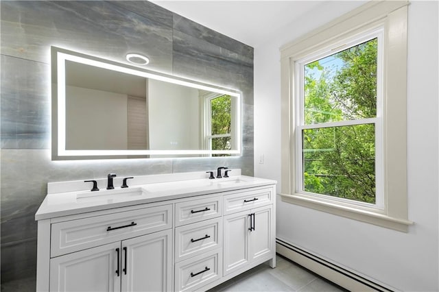 1314 Chalkstone Ave, Providence, RI 02908 - full bathroom with baseboard heating, healthy amount of natural light, and double vanity