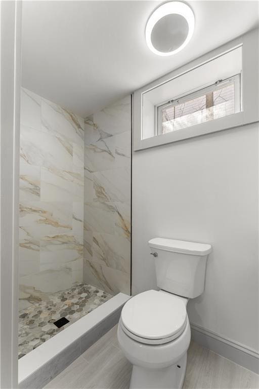 1314 Chalkstone Ave, Providence, RI 02908 - bathroom with toilet, a marble finish shower, and baseboards